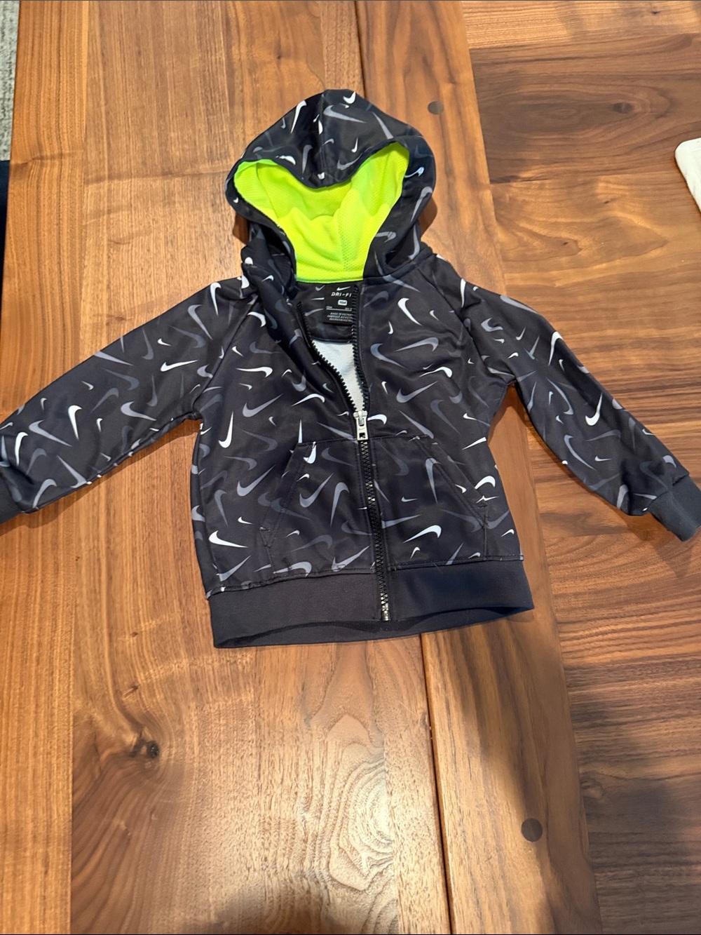 Nike Kids Black Hoodie with Neon Green Liner and Swoosh Print